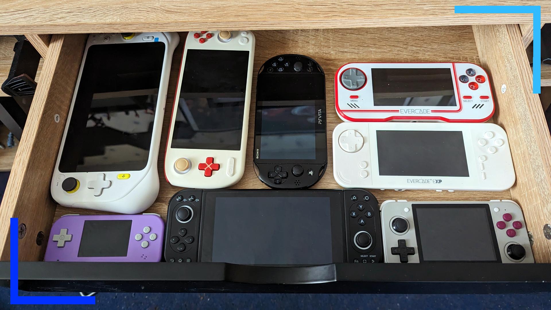 A photo of one of my drawers filled with handheld consoles. In this photo, you can see the Logitech G Cloud, AYANEO Pocket Air, PS Vita, Evercade, Evercade Arcade, TrimUI Smart, Pimax Portal, and an Anbernic RG351. 