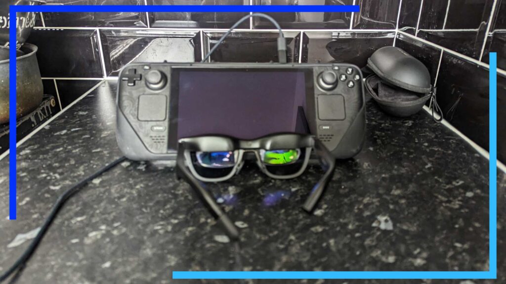 The Nreal Air connected to the Steam Deck via a USB cable with the glasses' screen visable.