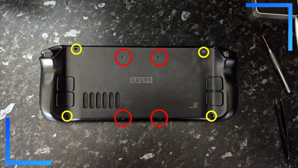 Photo of the Steam Deck with the back plate reattached and red and yellow circles above the screw holes.