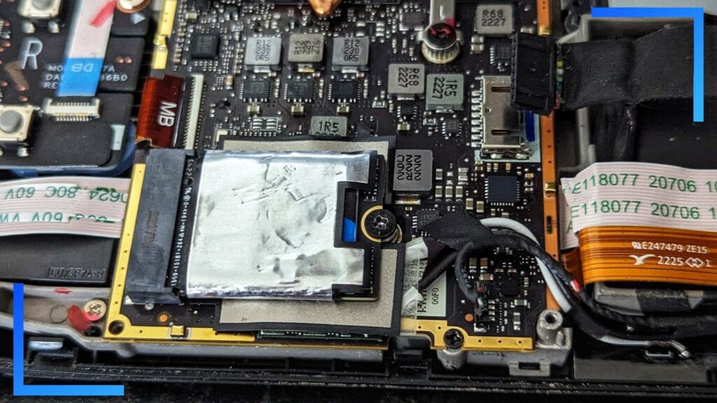 Close-up of the new SSD in place, with the screw holding it down.