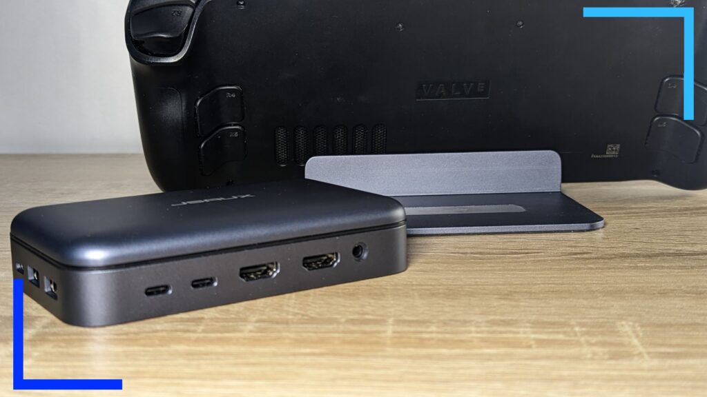 Close up photo of the JSAUX dock with a Steam Deck in it and the Omnicase 2. USB ports can be seen on the Omnicase 2, which is a shade of metallic grey. 