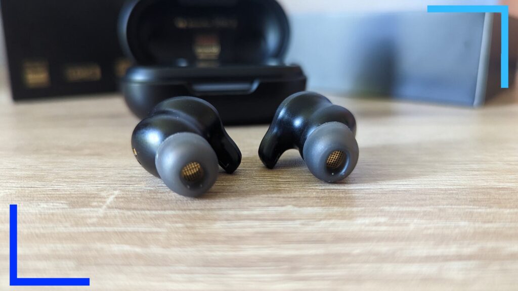 Close-up photo of the TOZO X1 earbuds showing the side that goes into the ear.