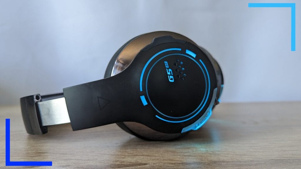 Photo of my Edifier G5BT gaming headset. A blue ring of light can be seen from the closest ear cup.