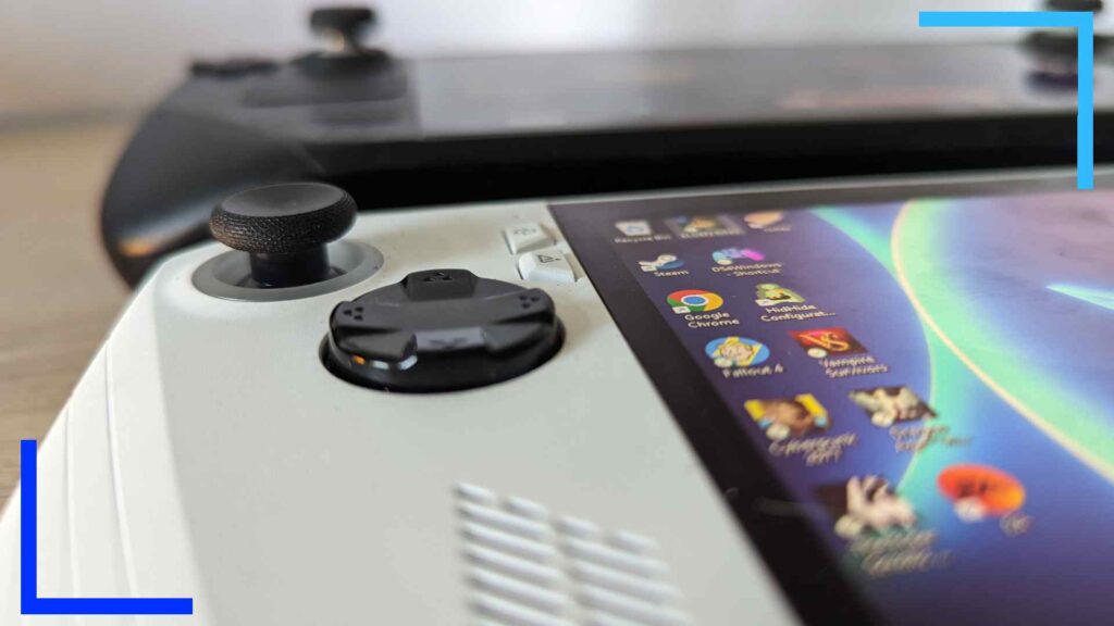 Close-up photo of the left analog stick on the ASUS ROG Ally. In the background, a blurred Steam Deck can be seen.