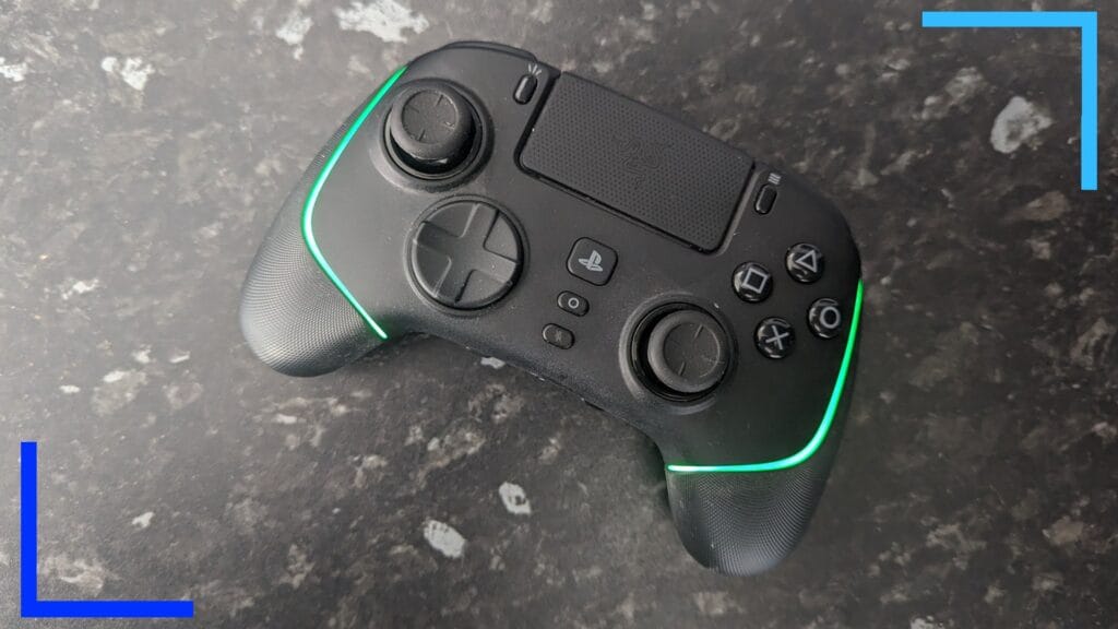 Bird's eye photo of the Razer Wolverine V2 Pro. A greenish light can be seen emanating from the controller's sides.