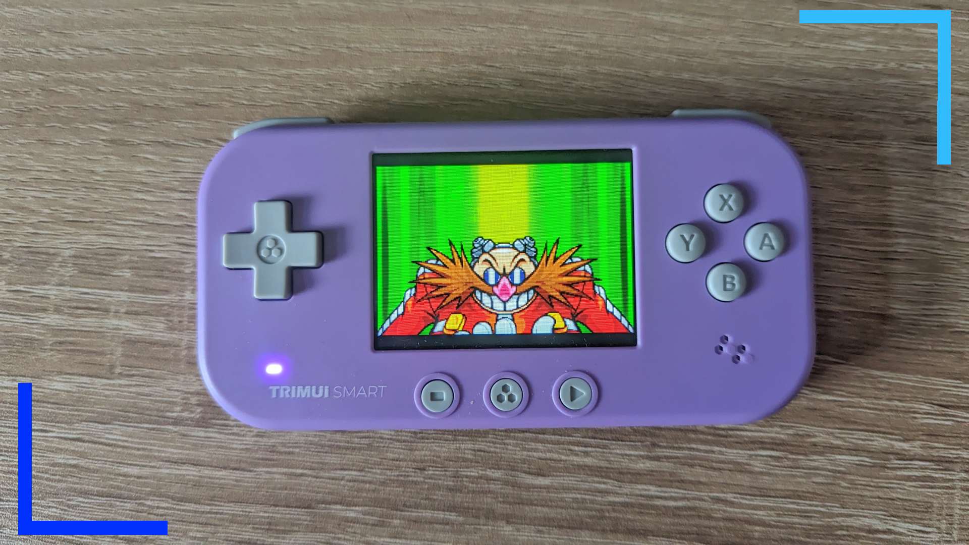 Photo of the purple TrimUI Smart with Sonic Advance on the main screen. 