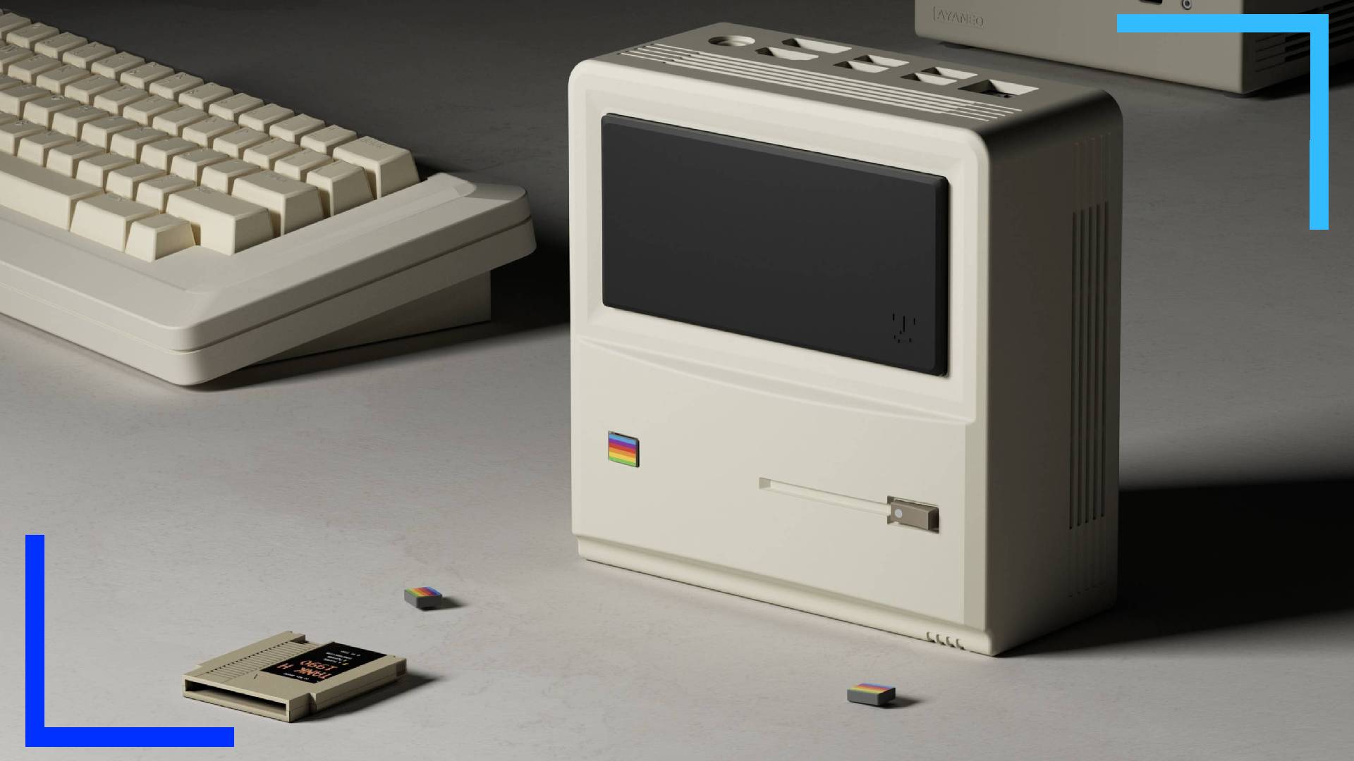 Promo image of the AM01, or Mac-style Retro Mini PC model alongside a white keyboard with a small NES cartridge in front.