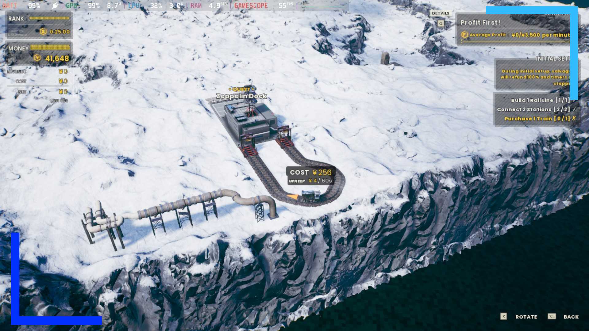 A train track and station is under construction in a snowfield. 