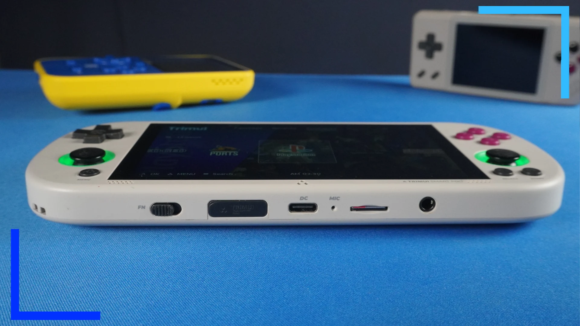 The bottom of the gray TrimUI Smart Pro showing the USB and SD card ports.