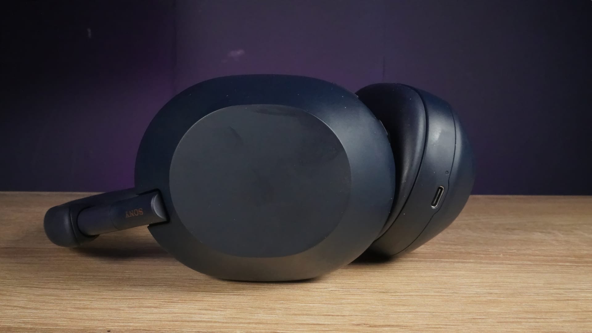 Close-up photo of the ear cups of the Sony WH-1000XM5 headphones.