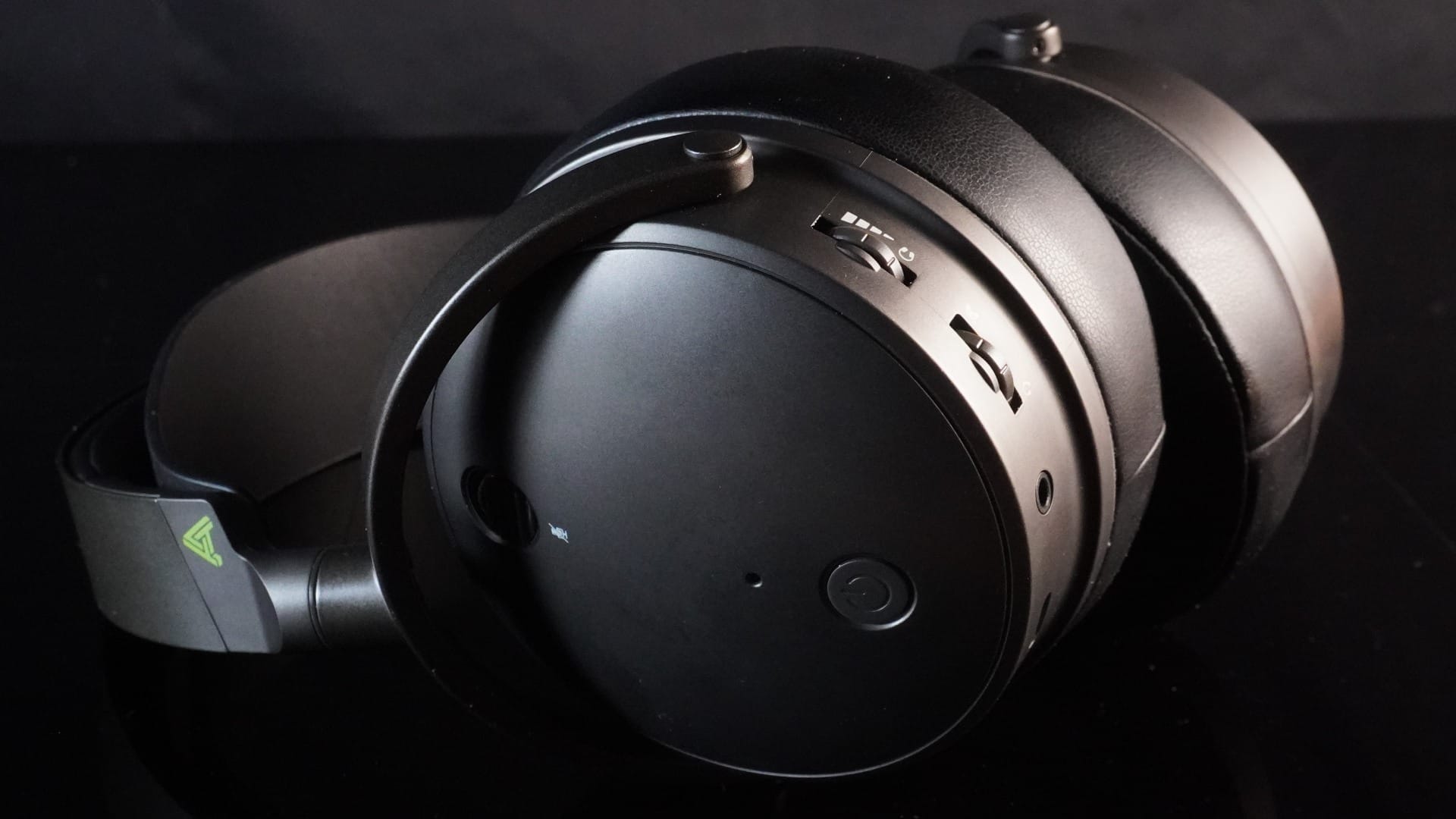 Side photo showing the main power on button on the left ear cup.